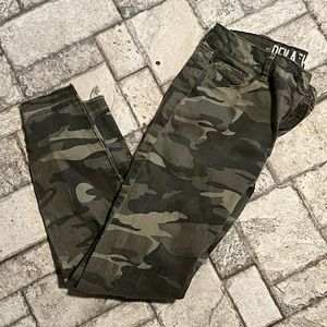 Camo skinny jeans with distressed bottoms, size 5